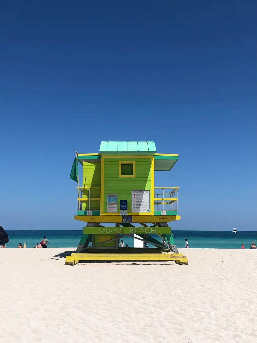 Lime-green lifeguard tower at 6th Street on South Beach, Miami Beach, with the ocean behind